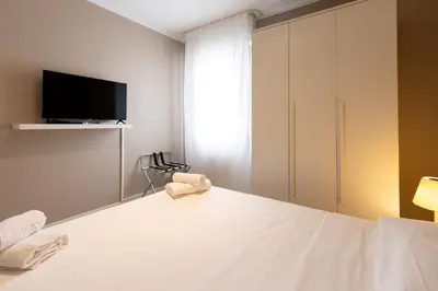 Letto o letti in una camera di JOIVY Padova Porta San Giovanni