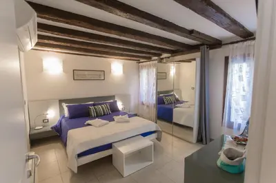 Letto o letti in una camera di B&B Antico Orologio