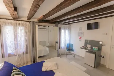 Letto o letti in una camera di B&B Antico Orologio