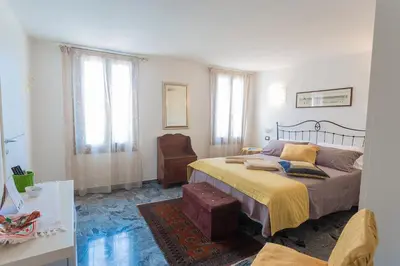 Letto o letti in una camera di B&B Antico Orologio