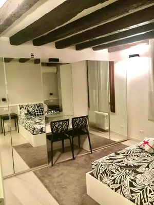Letto o letti in una camera di Venice Mirrors