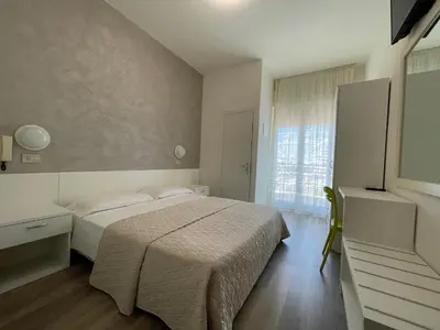 Letto o letti in una camera di Hotel Cristina