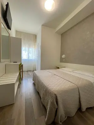 Letto o letti in una camera di Hotel Cristina