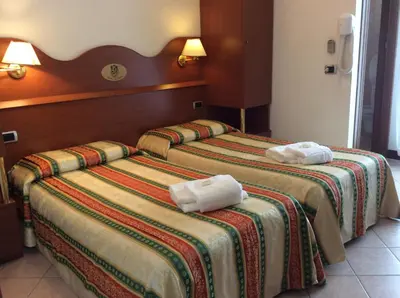 Letto o letti in una camera di Hotel Pizzeria Ristorante 