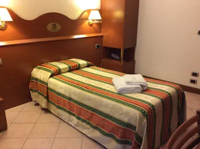 Letto o letti in una camera di Hotel Pizzeria Ristorante 