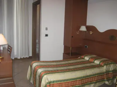 Letto o letti in una camera di Hotel Pizzeria Ristorante 