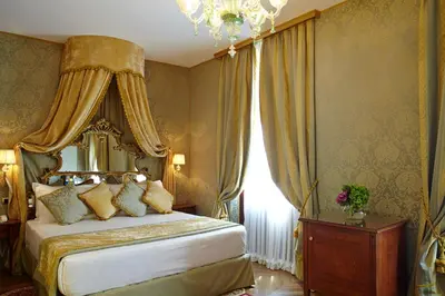 Letto o letti in una camera di Palazzo Paruta & Wellness Suites