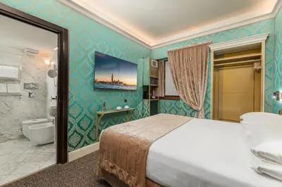Letto o letti in una camera di Palazzo Paruta & Wellness Suites
