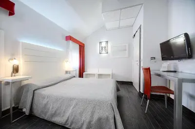 Letto o letti in una camera di Hotel Aaron