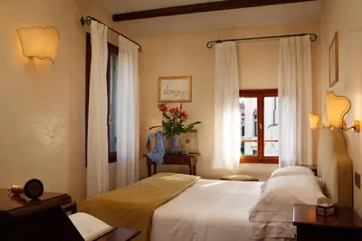 Letto o letti in una camera di Pensione Accademia - Villa Maravege