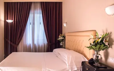 Letto o letti in una camera di Hotel Patavium