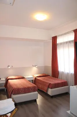 Letto o letti in una camera di Alla Bianca Hotel