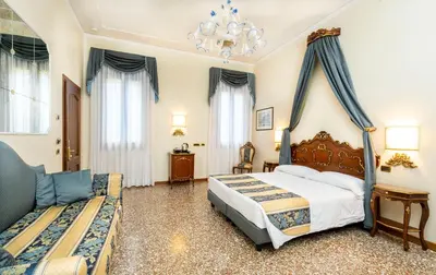 Letto o letti in una camera di Hotel Torino