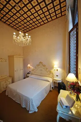 Letto o letti in una camera di Hotel Torino
