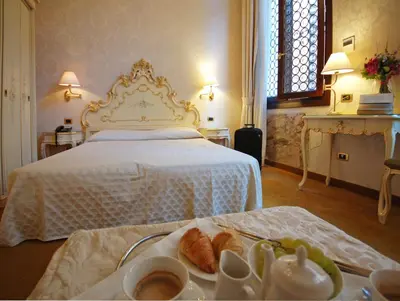 Letto o letti in una camera di Hotel Torino