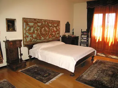 Letto o letti in una camera di Villa Tra' Monti