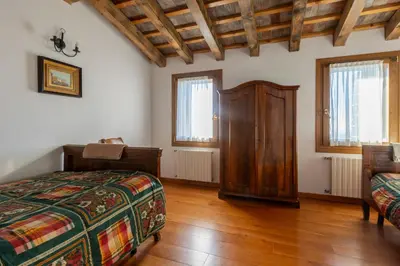 Letto o letti in una camera di Holiday House Petrarca