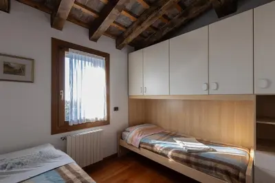 Letto o letti in una camera di Holiday House Petrarca