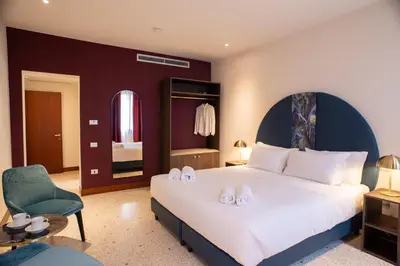 Letto o letti in una camera di Palazzina Fortuny