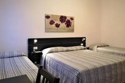 Letto o letti in una camera di Hotel Rossi