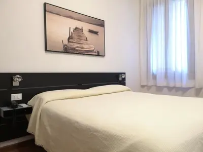 Letto o letti in una camera di Hotel Rossi