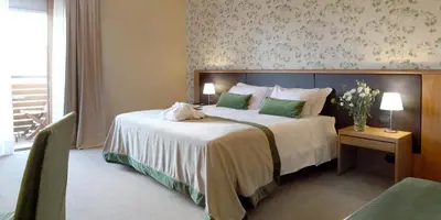 Letto o letti in una camera di Relais Le Betulle