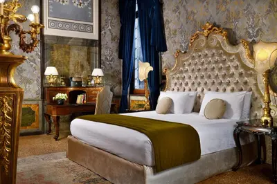 Letto o letti in una camera di Palazzo Venart Luxury Hotel