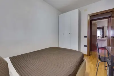 Letto o letti in una camera di Quartiere Padova 2000