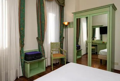 Letto o letti in una camera di Hotel Donatello