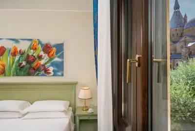 Letto o letti in una camera di Hotel Donatello