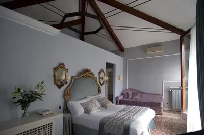 Letto o letti in una camera di Casa Colleoni