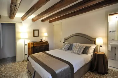 Letto o letti in una camera di Casa Colleoni