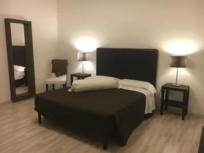 Letto o letti in una camera di Sunday Apartments