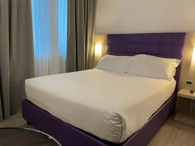 Letto o letti in una camera di Hotel Omnia