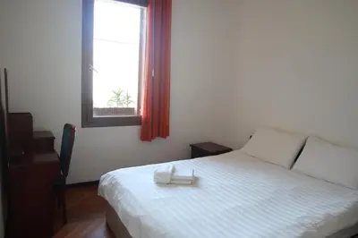 Letto o letti in una camera di b&b Wu Giada