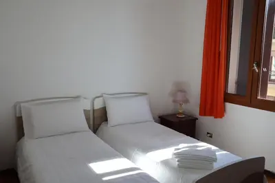 Letto o letti in una camera di b&b Wu Giada