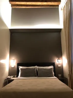 Letto o letti in una camera di Albergo al Tiepolo