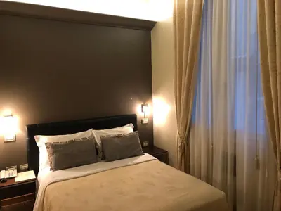 Letto o letti in una camera di Albergo al Tiepolo