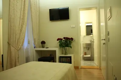 Letto o letti in una camera di Albergo al Tiepolo