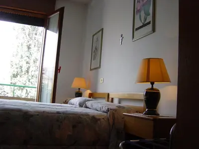 Letto o letti in una camera di Hotel Rizzi