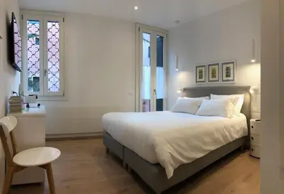 Letto o letti in una camera di San Marco Design Suites