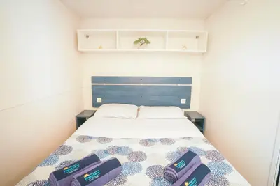 Letto o letti in una camera di Happy Camp Mobile Homes in Camping Village Rosapineta