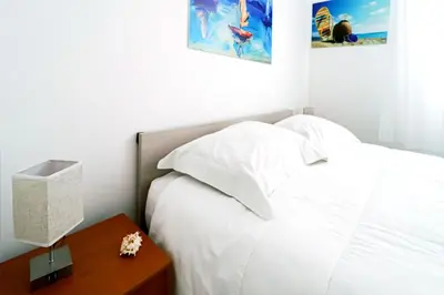 Letto o letti in una camera di Appartamenti Gherbin Jesolo