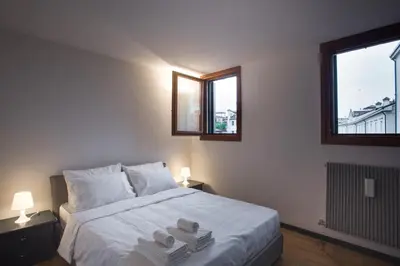 Letto o letti in una camera di Filodrammatici Loft by Welc(H)ome