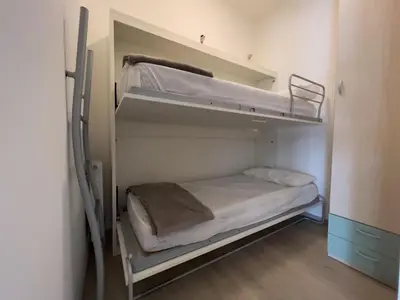 Letto o letti in una camera di Appartamenti Villa Paola-Pochi passi dal mare-Zona piazza Aurora-Lido di Jesolo