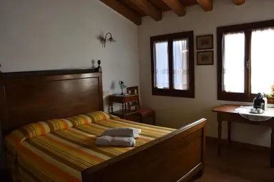 Letto o letti in una camera di Ca Borgh
