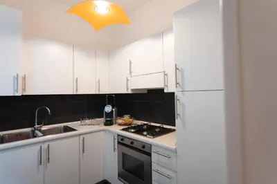 Cucina o angolo cottura di Cà Sottomarina gli Appartamenti in Centro Apartsuite