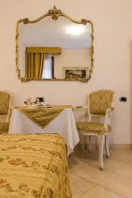 Letto o letti in una camera di Angeles Inn