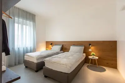 Letto o letti in una camera di C-Apartments