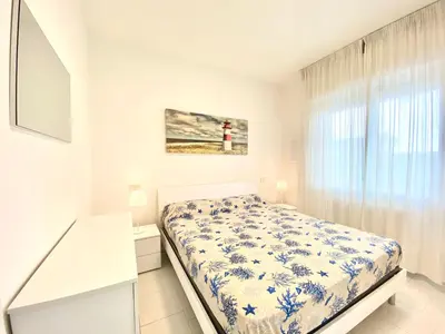 Letto o letti in una camera di Appartamenti Cristina - Carraro Immobiliare - Family Apartments